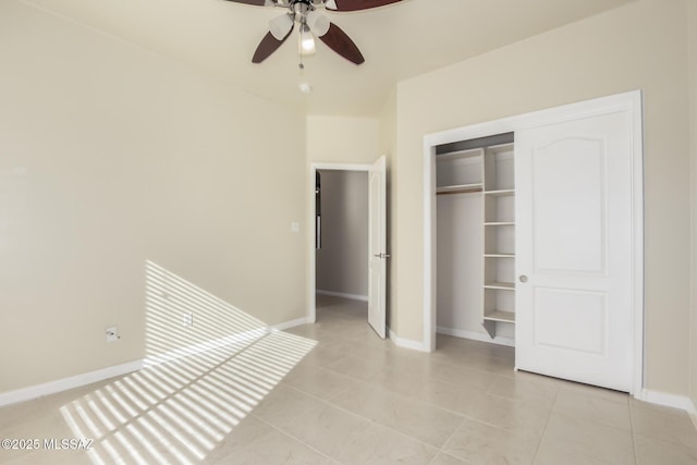 unfurnished bedroom featuring a closet, ceiling fan, and light tile patterned floors