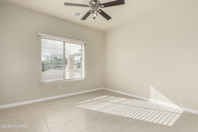 spare room with light tile patterned floors and ceiling fan