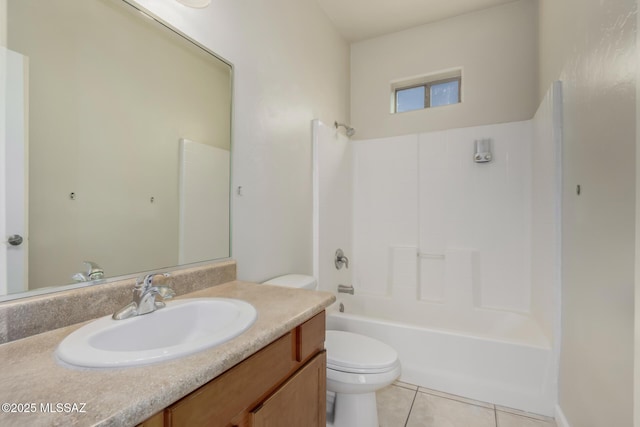 full bathroom featuring washtub / shower combination, toilet, tile patterned flooring, and vanity