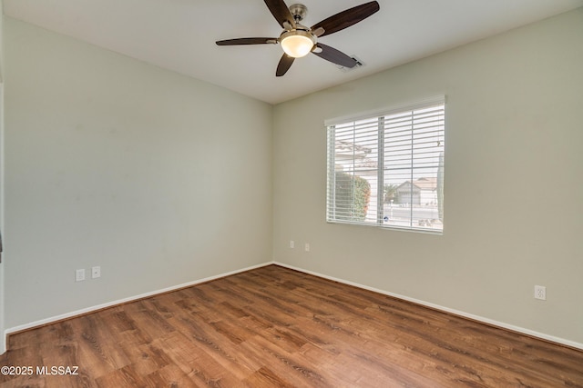 unfurnished room with hardwood / wood-style flooring and ceiling fan