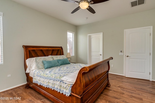 bedroom featuring hardwood / wood-style flooring and ceiling fan