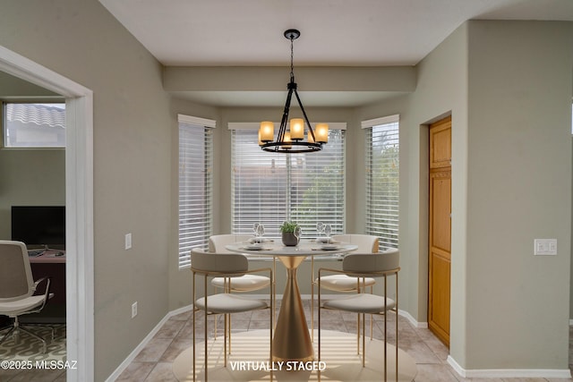 dining area featuring an inviting chandelier