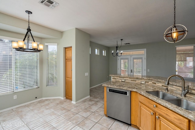 kitchen with dishwasher, sink, an inviting chandelier, and decorative light fixtures