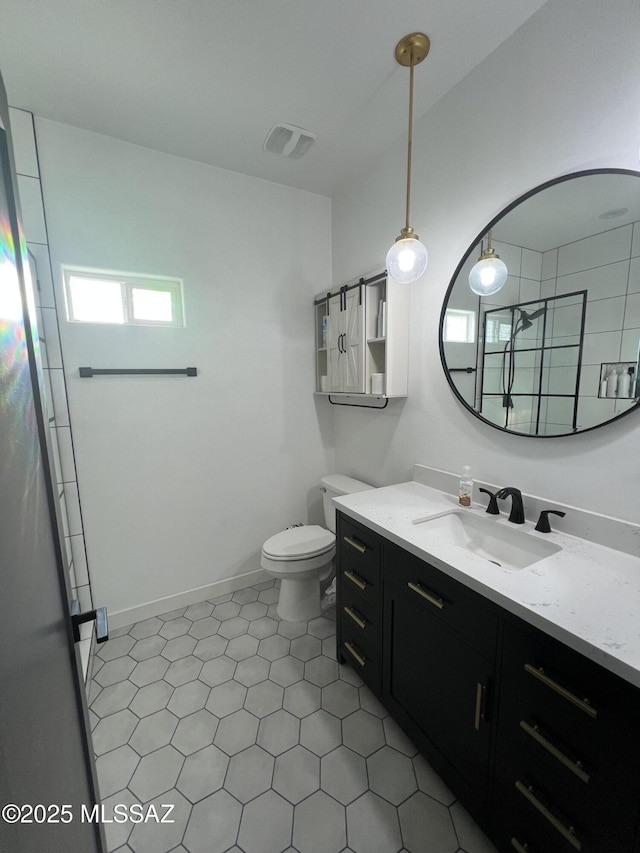 bathroom with toilet, tile patterned flooring, an enclosed shower, and vanity