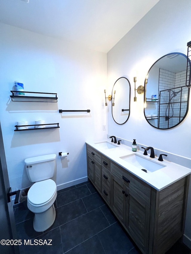 bathroom featuring vanity, toilet, and tile patterned flooring