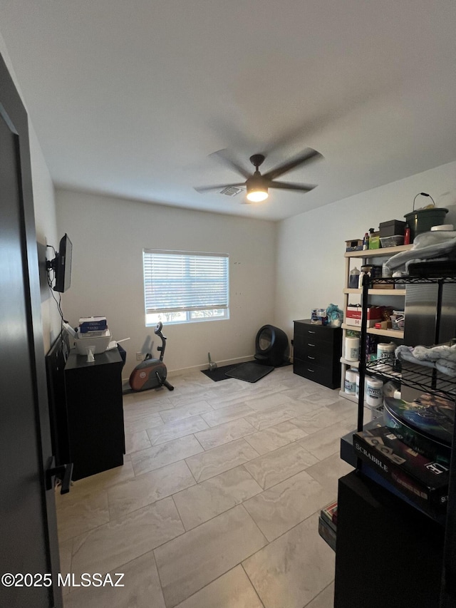 interior space featuring ceiling fan