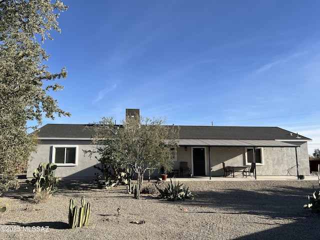 back of house with a patio area