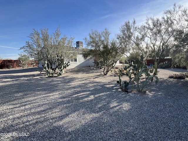 view of property hidden behind natural elements