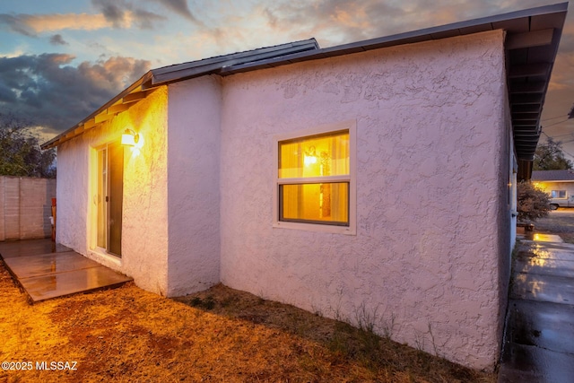 view of property exterior at dusk