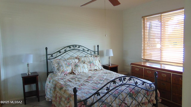 tiled bedroom with ceiling fan