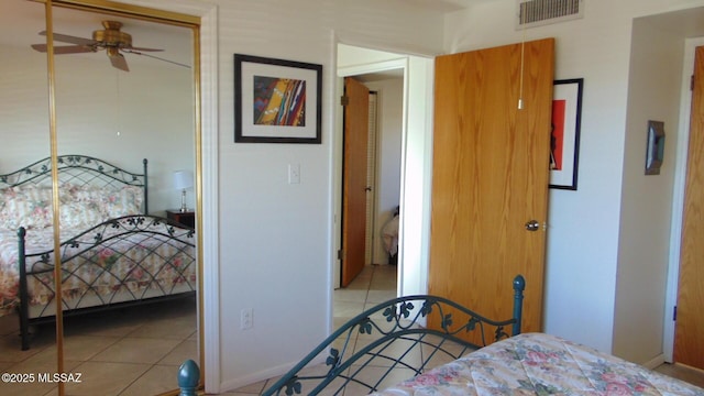 bedroom featuring ceiling fan and light tile patterned floors