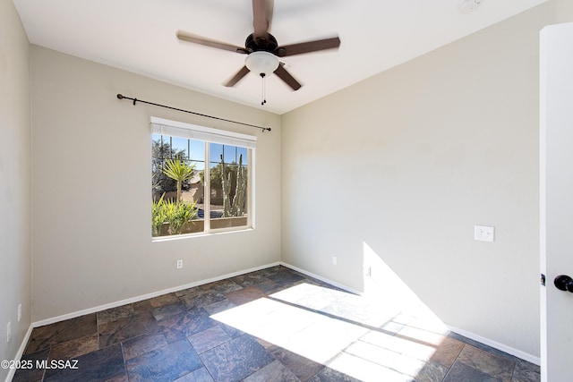 spare room with ceiling fan