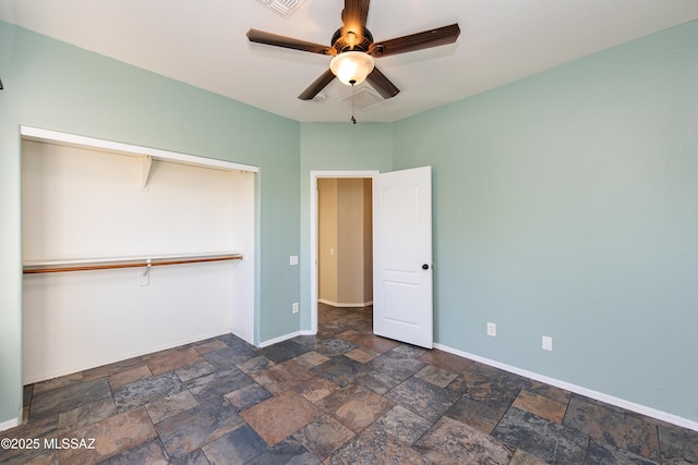 unfurnished bedroom featuring ceiling fan and a closet