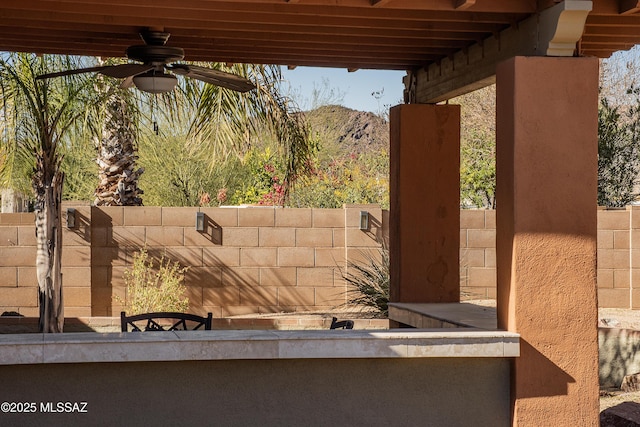 view of patio featuring ceiling fan