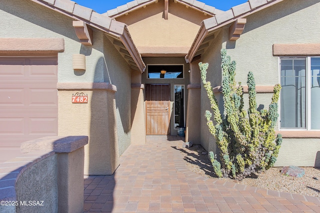 property entrance with a garage