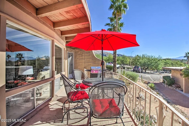 exterior space with a balcony and grilling area