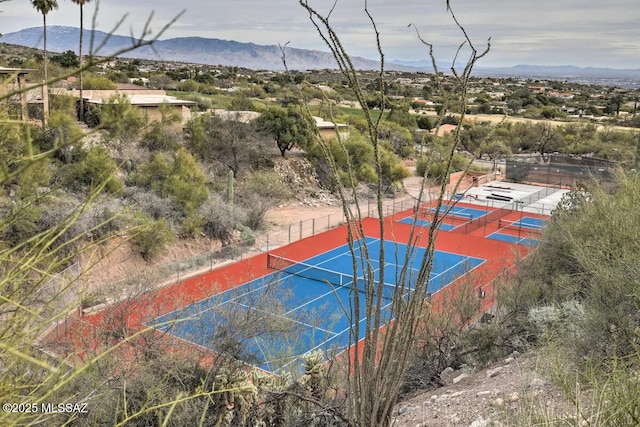 view of sport court with a mountain view