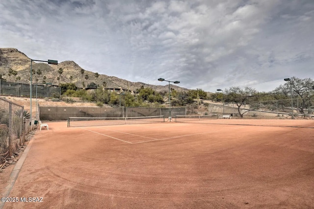 view of sport court with a mountain view