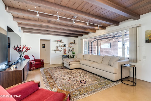 living room with beamed ceiling, wooden ceiling, and track lighting