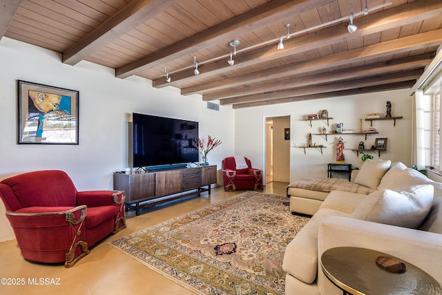 living area with visible vents, beamed ceiling, wooden ceiling, and track lighting