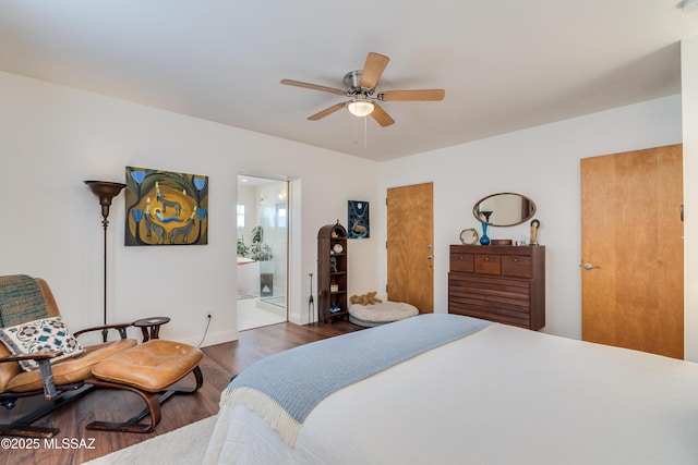 bedroom featuring ensuite bath, a ceiling fan, baseboards, and wood finished floors