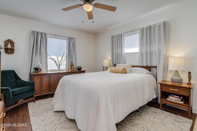 bedroom featuring dark hardwood / wood-style floors and ceiling fan