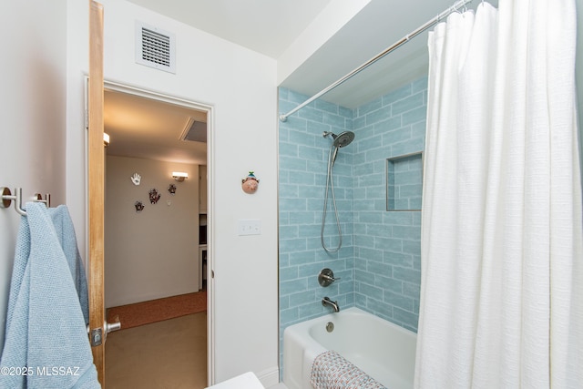 bathroom with visible vents and shower / bath combo with shower curtain