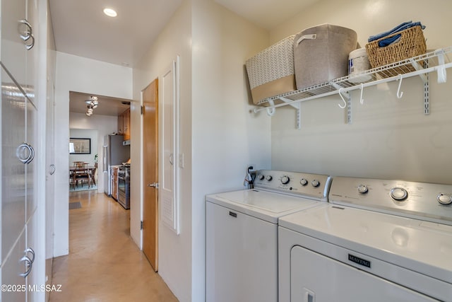 laundry area with laundry area, recessed lighting, and separate washer and dryer