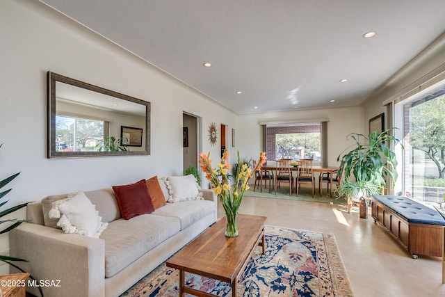 living room with recessed lighting and a healthy amount of sunlight