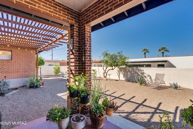 view of patio with a fenced backyard and a pergola