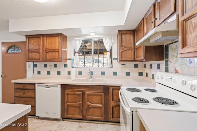 kitchen featuring white appliances, sink, decorative backsplash, and light tile patterned floors