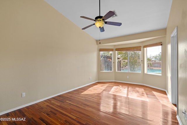 unfurnished room with light wood-type flooring, ceiling fan, and lofted ceiling