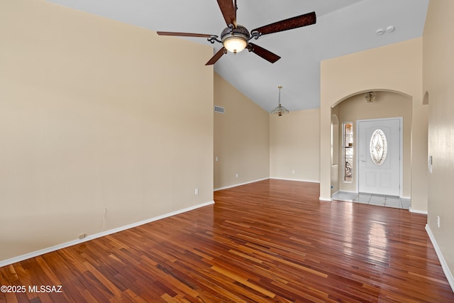 foyer featuring high vaulted ceiling, hardwood / wood-style floors, and ceiling fan