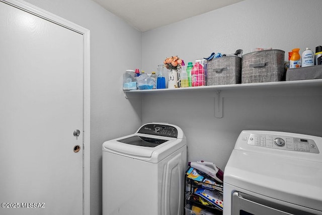 washroom with washing machine and dryer