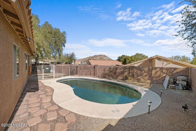 view of pool with a mountain view