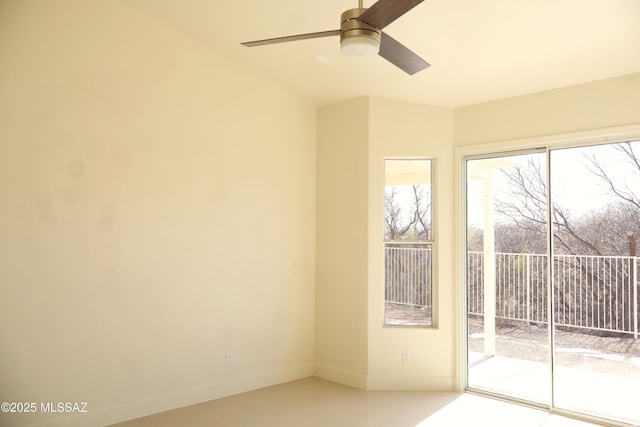 entryway with a ceiling fan and baseboards