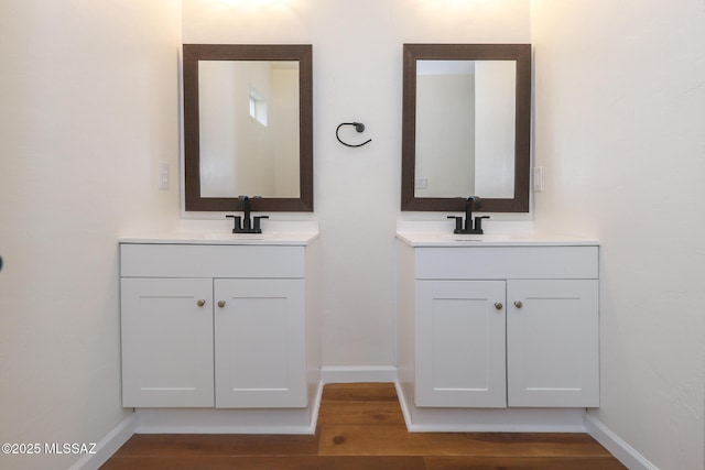 bathroom featuring hardwood / wood-style flooring and vanity