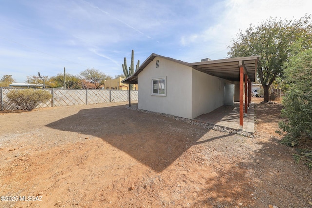 exterior space featuring a carport