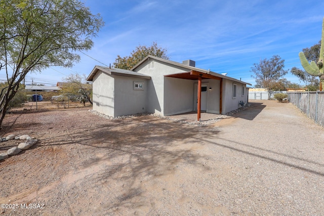 back of house with a patio area