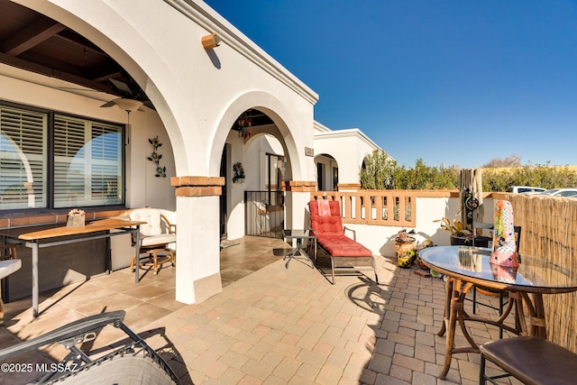 view of patio / terrace featuring ceiling fan