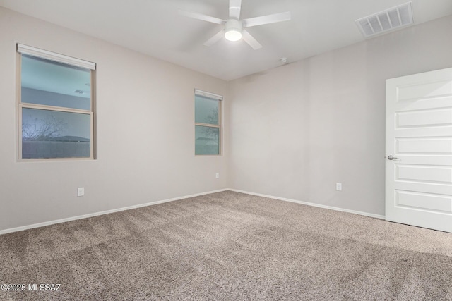 carpeted empty room with ceiling fan