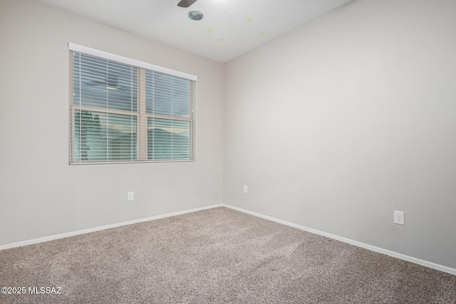 unfurnished room featuring carpet flooring and ceiling fan