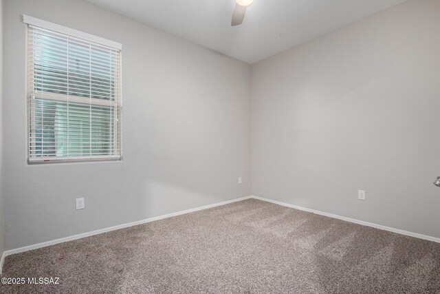 carpeted empty room with ceiling fan