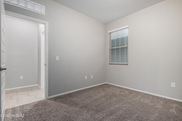 view of carpeted spare room