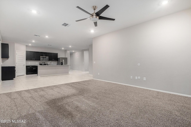 unfurnished living room featuring light colored carpet and ceiling fan