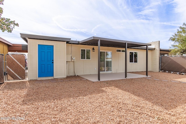 back of house featuring a patio area