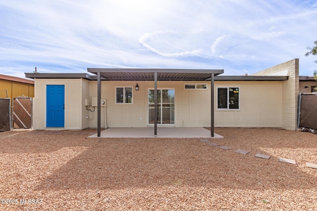 rear view of property featuring a patio