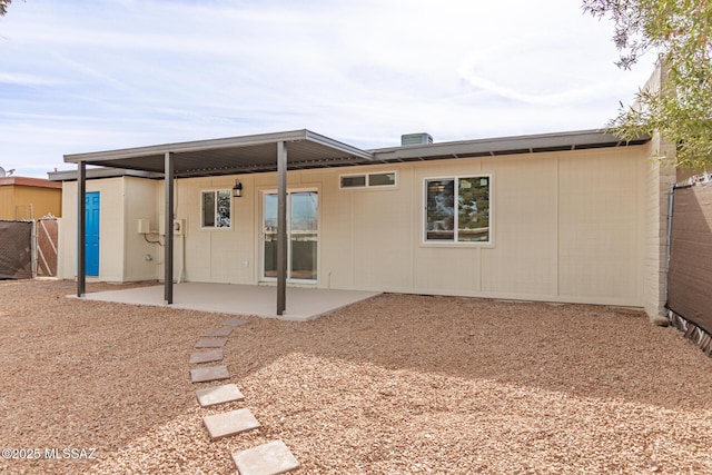 back of property featuring a patio