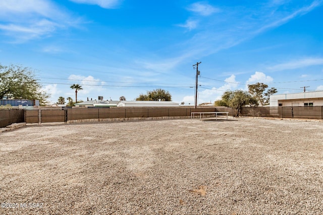 view of yard with a trampoline