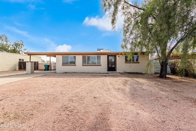 ranch-style house with a carport